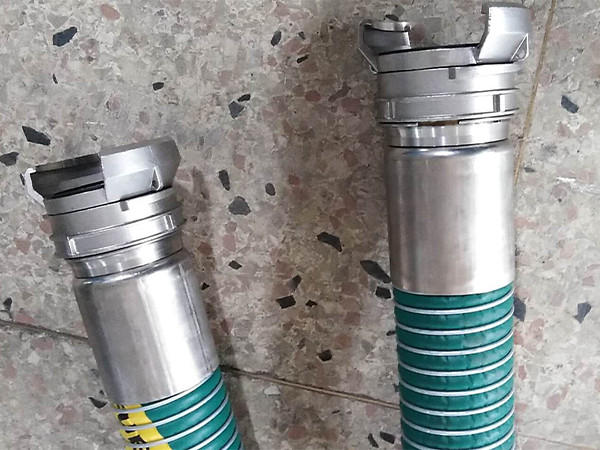 Composite hose with camlock fitting