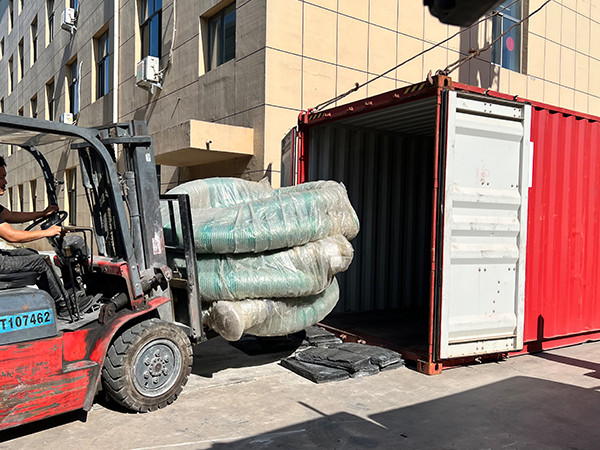 Forklift transporting composite hose
