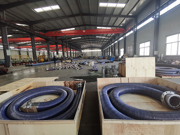 Blue composite hose packed in wooden box