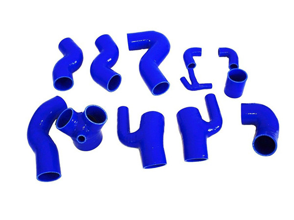 10 different blue elbow silicone hoses on a white background