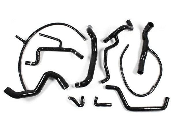 Some black elbow silicone hoses with different shapes on a white background