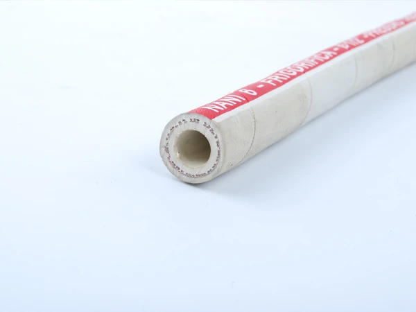A red food grade rubber hose with a red printed label