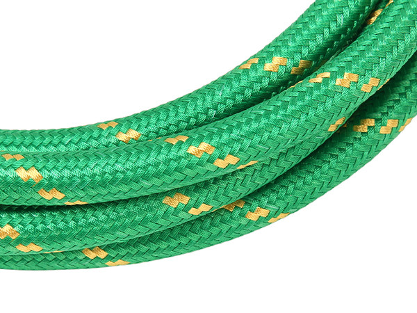 A green steam silicone hose with yellow patterns