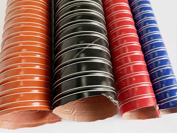 Four high temperature silicone duct hoses of different colors placed on a flat surface