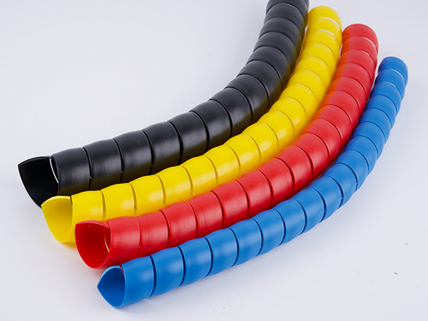 Four different colored hydraulic hose plastic spiral protectors