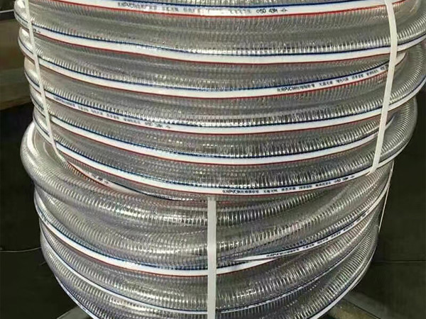 Two PVC steel wire reinforced hoses packaged and stacked together