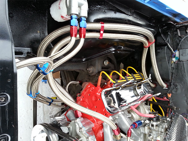 SAE 100R14 PTFE lined hydraulic hose installed in the air compressor exhaust system of a delivery truck