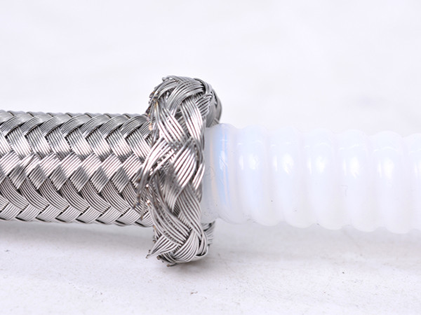 A SAE 100R14 PTFE lined hydraulic hose showing internal and external details