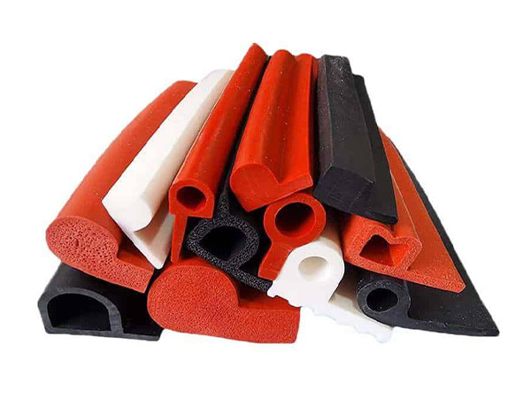 Red, black, and white D-shaped silicone edging strips.