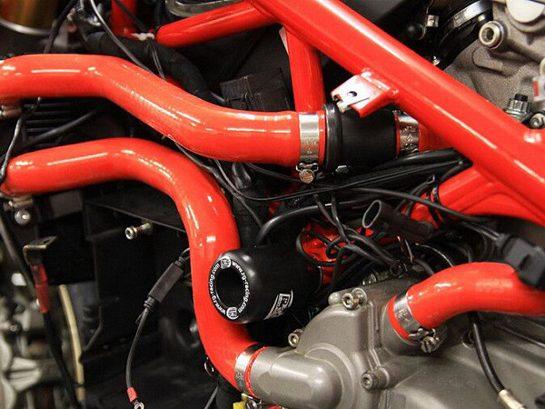 Two red silicone hose car kits are mounted on the motor.