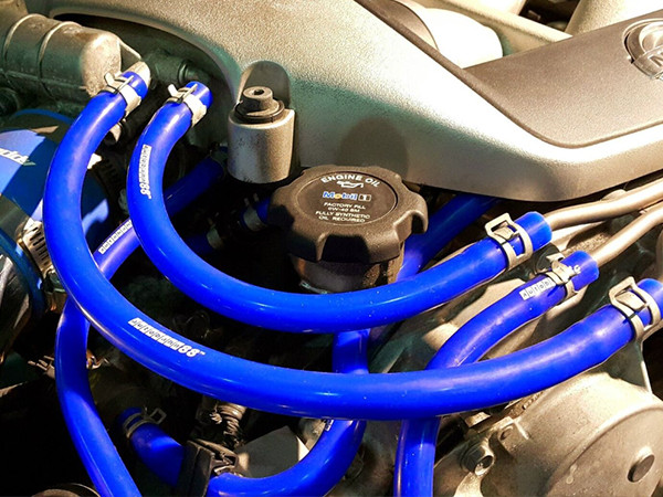 3 blue silicone hose car kits are installed in the engine compartment.