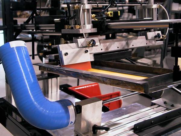 A screen printing machine for silicone hoses in the factory