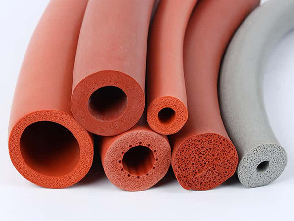 Five red and one gray silicone sponge foam tubes.