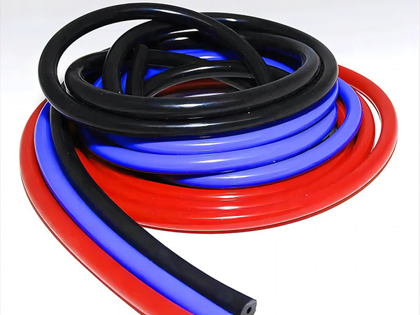 3 silicone vacuum hoses placed together in red, purple and black