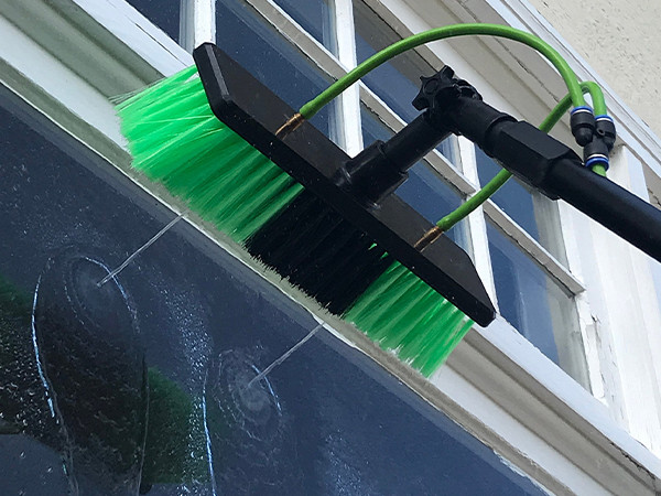 Steel Wire Reinforced Nylon Resin Hose Transporting water to clean glass with a broom